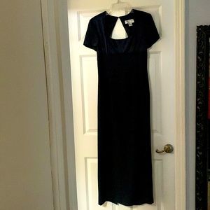 Evening length. Cap-sleeved. Empire waist. Open/keyhole back.